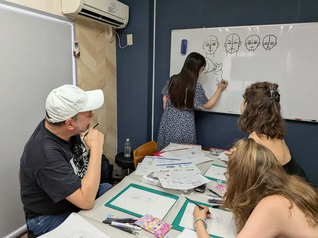 Sensei demonstrating character drawing on the whiteboard while guests watch