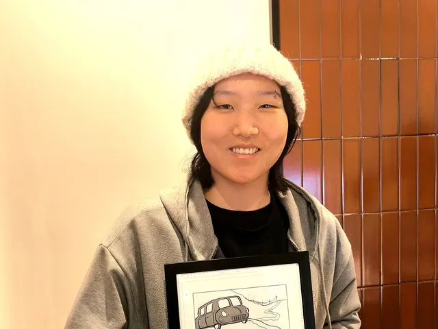 Guest smiling with her framed manga