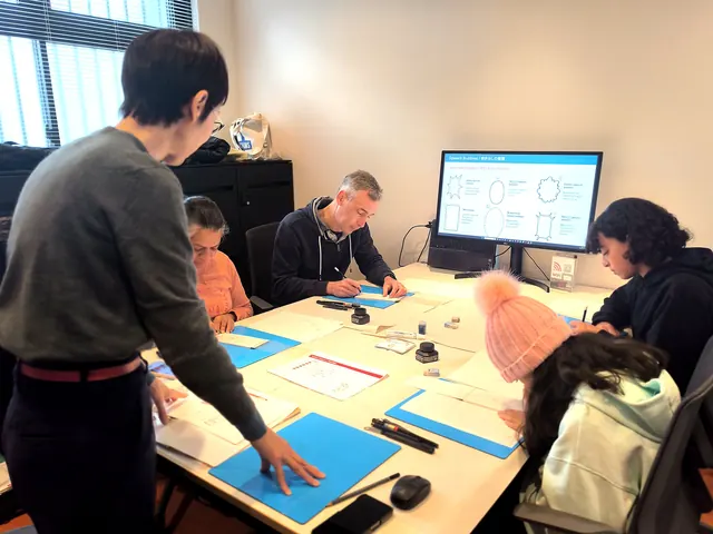 Sensei guiding guests at the table
