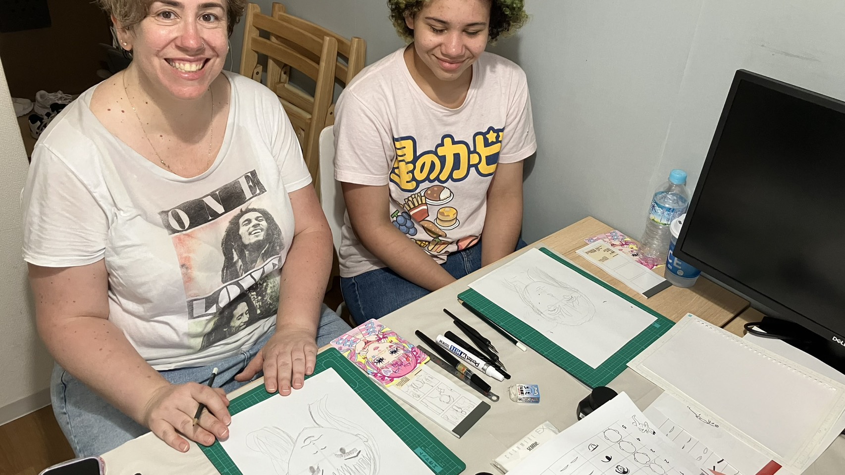 Mother and daughter working on their manga sketches together